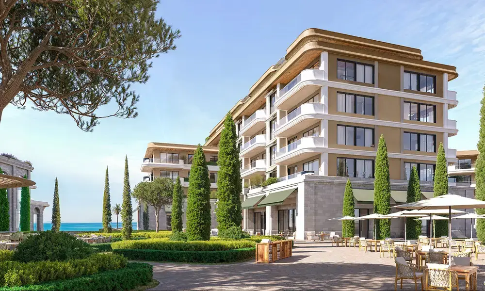 Porta Rai residence building framed by pine trees