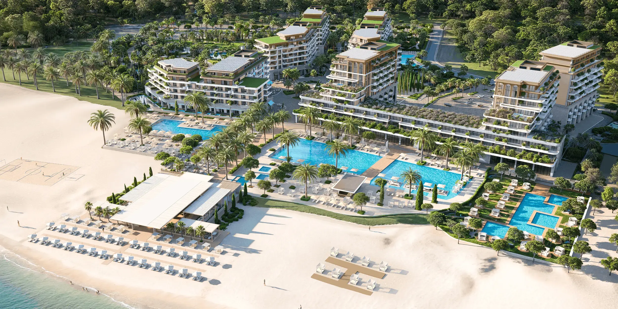 Aerial view of Porta Rai Beachfront Hotel & Residences, its pools and the beach